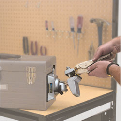The PanaVise 380 Vacuum Base with vise head attached to the side of a toolbox