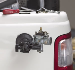 The PanaVise Model 209 vacuum base PV Jr attached to vehicle body