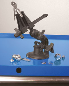 The PanaVise Model 209 vacuum base PV Jr attached to a metal panel to change a lock cylinder