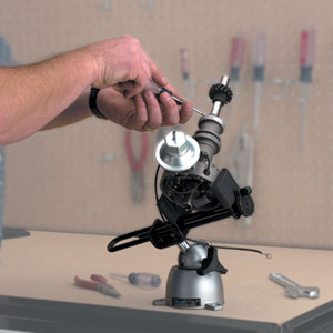 Using the 396 wide opening PanaVise to hold a rounded machine part during adjustments