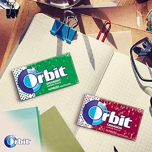 Orbit brand chewing gum for school or studying. Packs of gum on notebook
