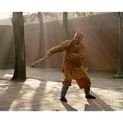Monk performing staff form