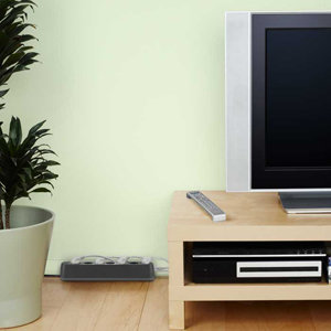 F7C013ad Conserve Smart AV Energy Saving Power Strip in a livingroom