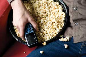 This is a picture of a hand holding popcorn