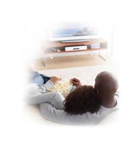 This is a picture of a couple watching tv