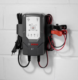 The Bosch C7 12V and 24V, Fully Automatic 6-Mode Battery Charger and Maintainer mounted on a wall