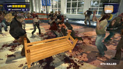 Frank West surrounded by zombies in 'Dead Rising'