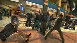 Frank West battling zombies with a frying pan in 'Dead Rising'