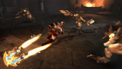 Kratos battling numerous smaller enemies simultaneously in God of War: Ghost of Sparta