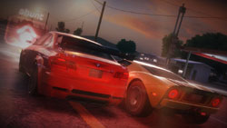 Two cars racing all out to be the first to pick-up a power-up in 'Blur'