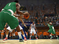 Michigan State player cutting to the hoop against an Illini defender in NCAA Basketball 10 Michigan State player cutting to the hoop against an Illini defender in NCAA Basketball 10