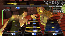A singer and bassist rocking it tight in multiplayer mode in Rock Band Track Pack: Volume 2