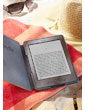 Kindle e-reader: reads like real paper, even in bright sunlight, as shown by a Kindle on a beach blanket