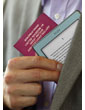 Kindle e-reader: small and light, as shown when held in hand with a passport