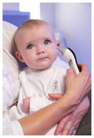 Baby with Tommee Tippee Closer to Nature Thermometer in their ear