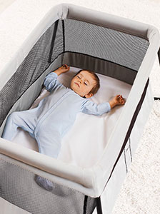  The BabyBjorn Travel Carry Cot Light with sleeping baby