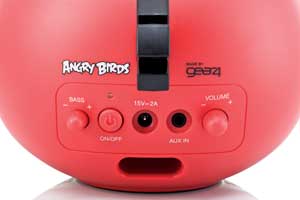The rear of the speaker includes bass and volume control, an AUX-in port, and the power button.