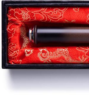 The Kymera Wand nestles seductively in its silk-lined box