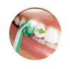 Place nozzle between teeth