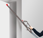 Using the longer wand to clean in tight ceiling corners