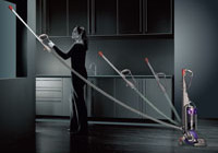 Person using the Quick-draw Telescope Reach wand in the home