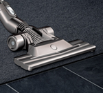 Side of the dual mode floor tool as it moves over carpet